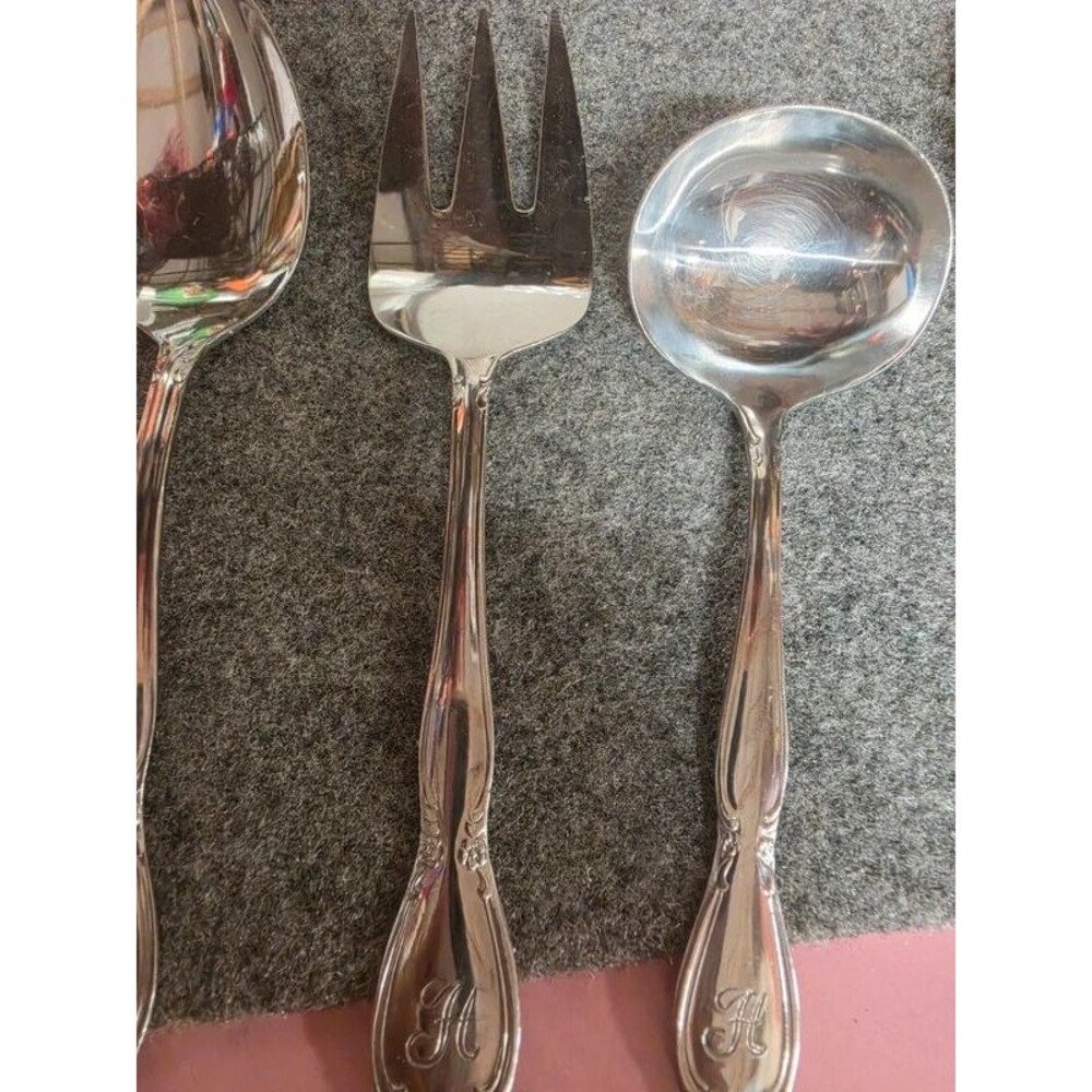 Serving set 2 spoons and a fork. Stainless